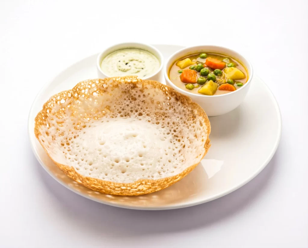Appam served with vegetable stew and chutney South Indian catering dish for events in London