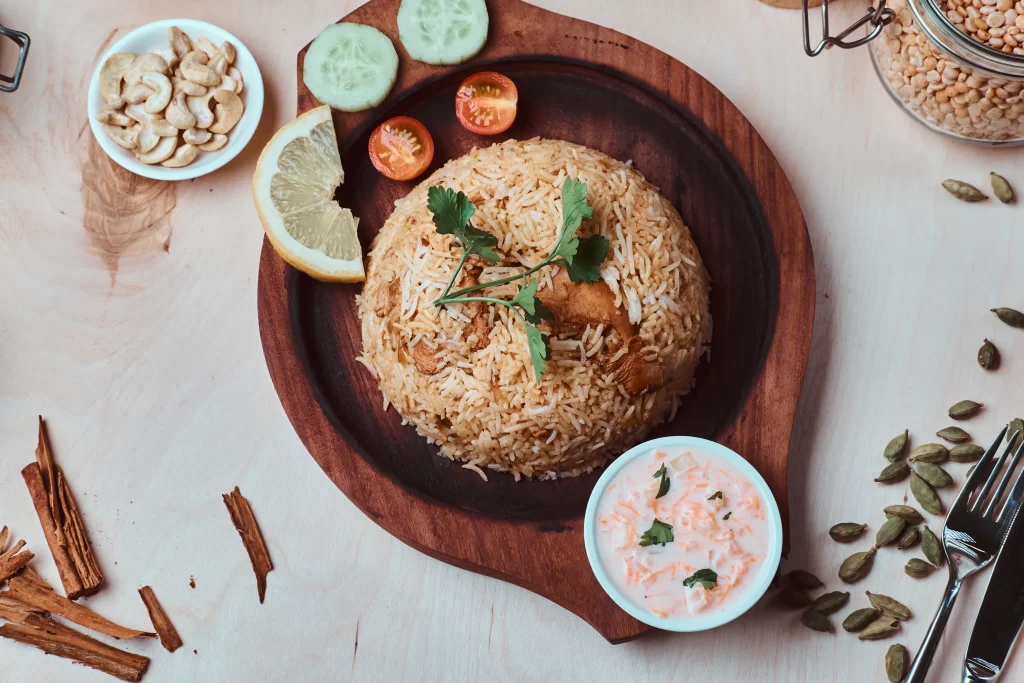 Authentic halal biryani in North London served with South Indian spices and raita at Chennai Spice